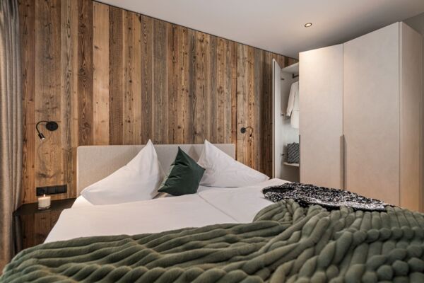 Doppelbett im Apartment Penken im Schrofenblick Alpen Resort